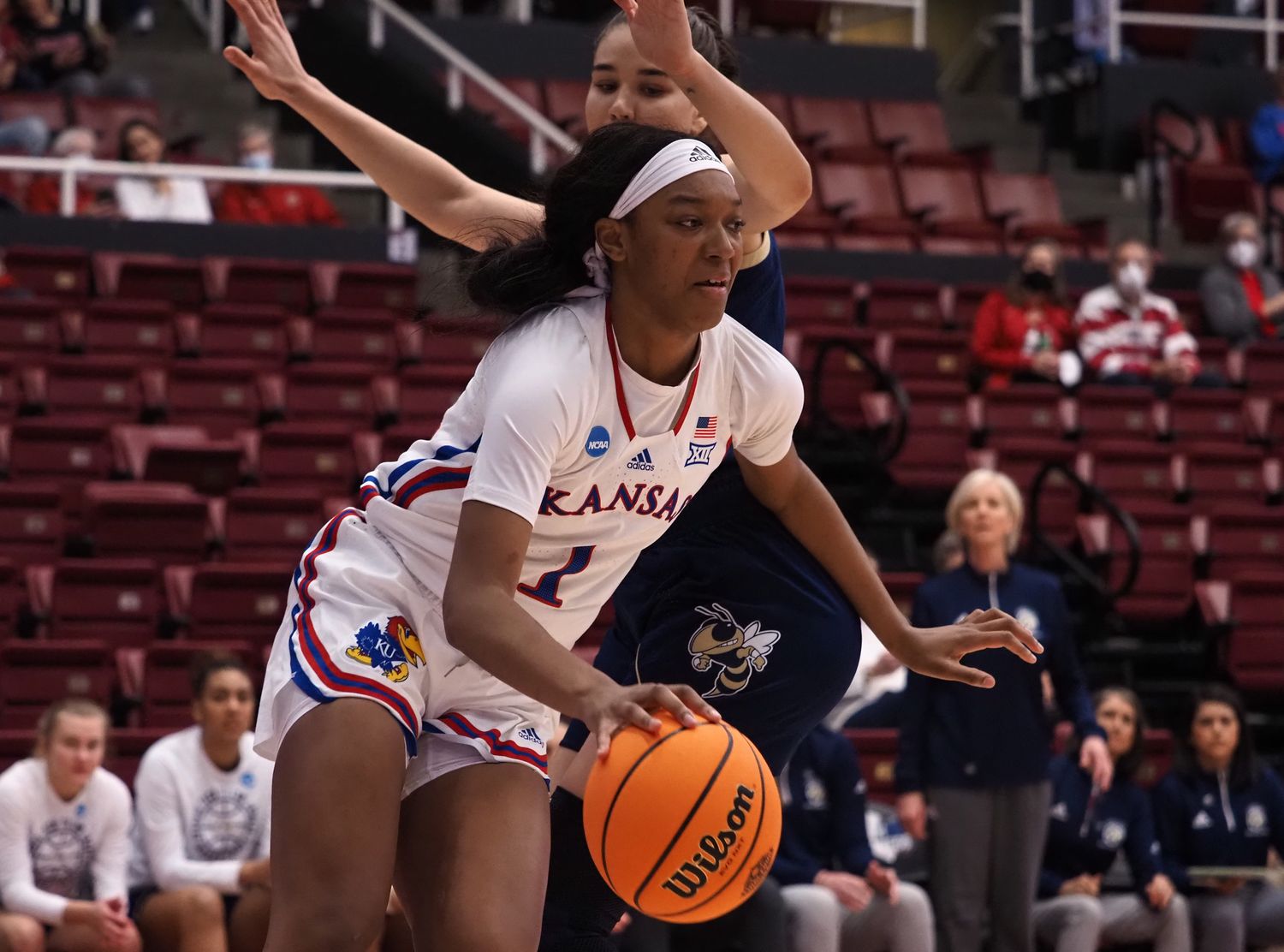 Mar 18, 2022; Stanford, California, USA; Kansas Jayhawks center Taiyanna Jackson (1) controls the ball against Georgia Tech Yellow Jackets center Nerea Hermosa (20) during the first quarter at Maples Pavilion. Mandatory Credit: Kelley L Cox-USA TODAY Sports
